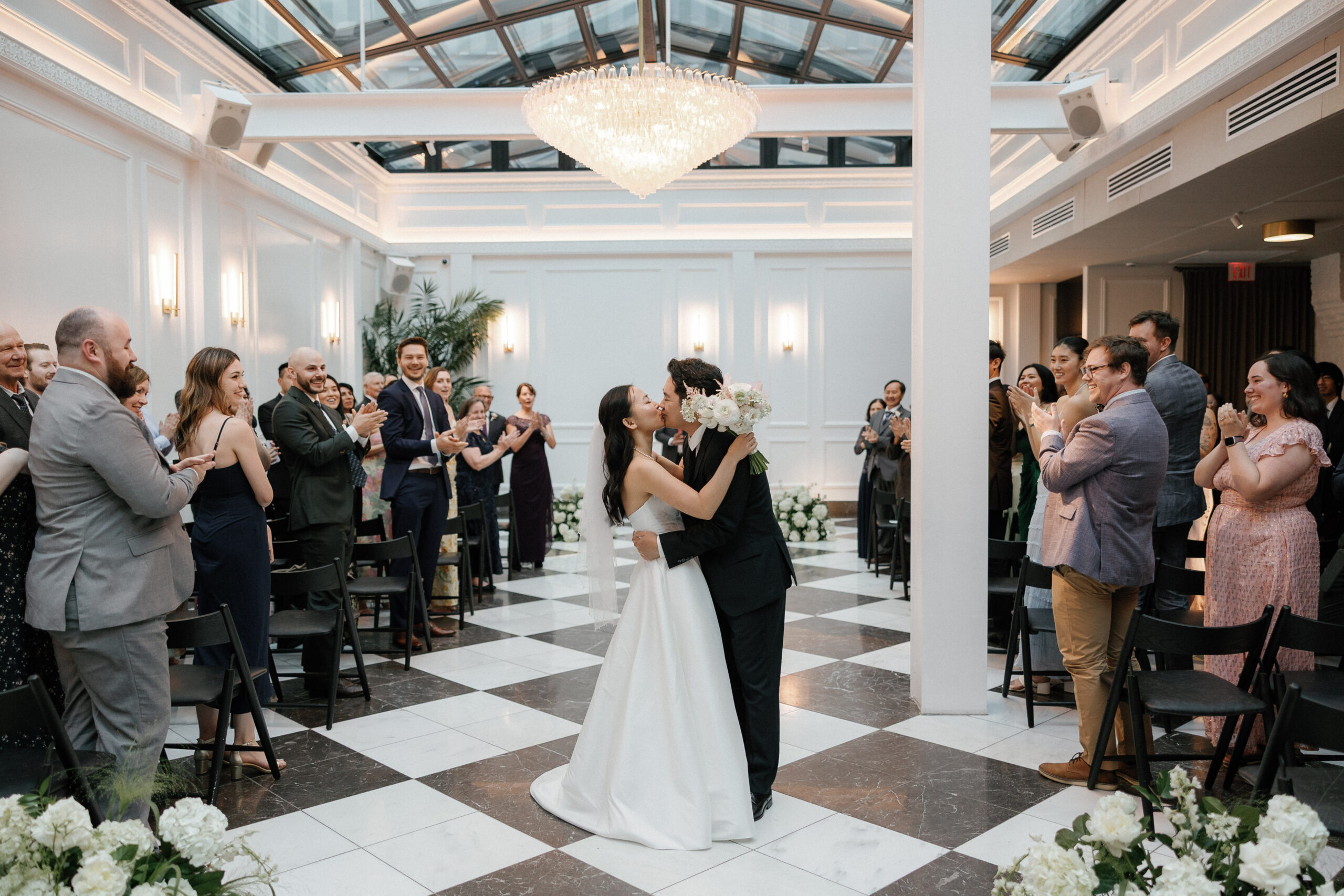 Bride and groom sharing their first dance at Salon 61 surrounded by guests, photographed by Chicago wedding photographer Abe Fernandez